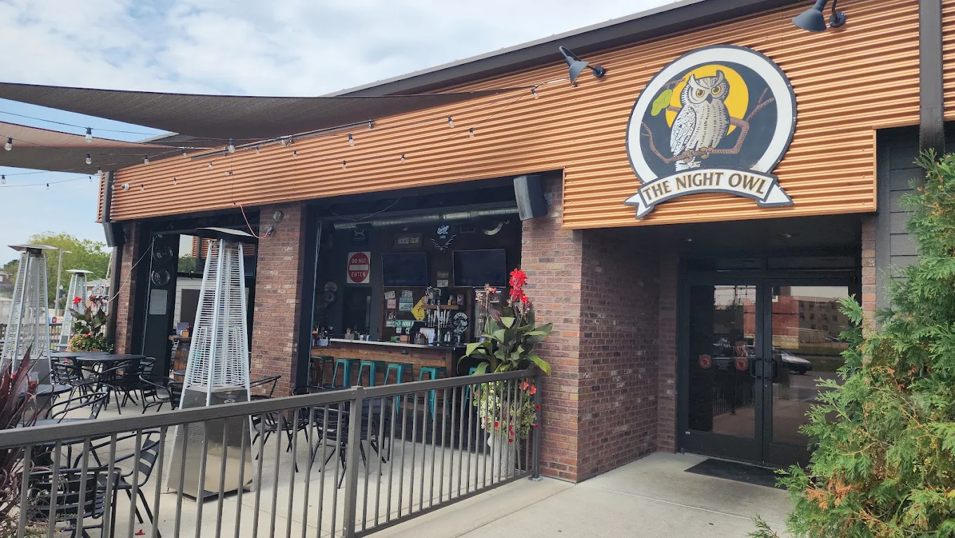 The Night Owl storefront and patio on Main Street in Evansville