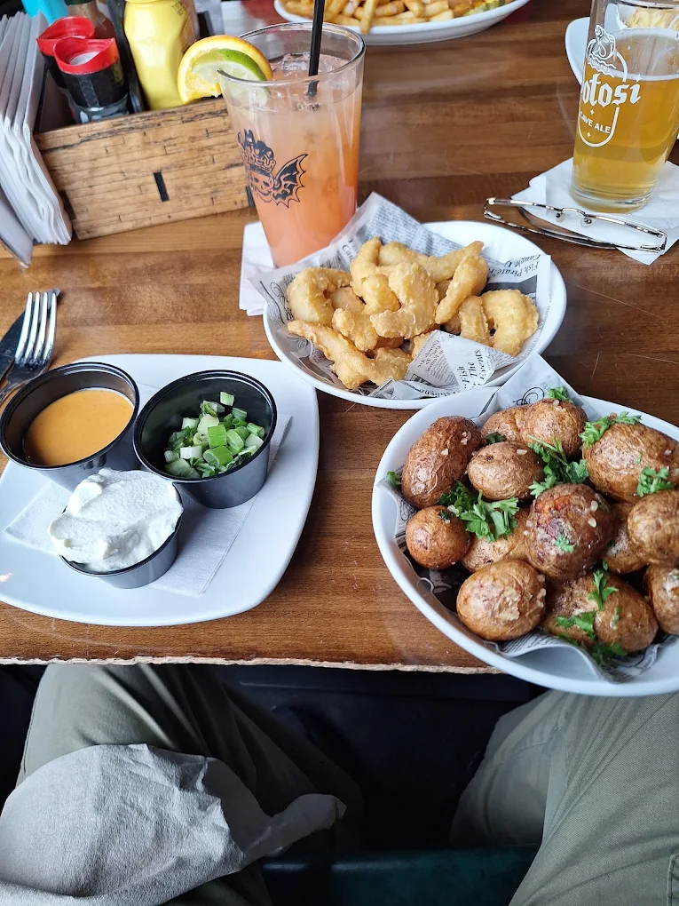 Wisconsin cheese curds and potatoes with a cold beer at The Night Owl